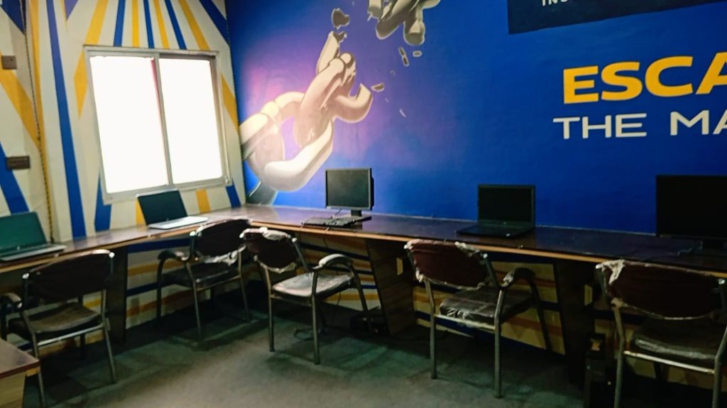 Computer lab with desks and laptops